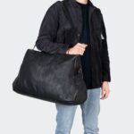 Visuel homme avec sac weekend cuir noir Melrose